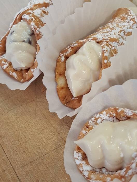Cannoli dusted with powdered sugar