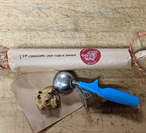 Sugar Mamas chocolate chip cookie dough log with a scoop